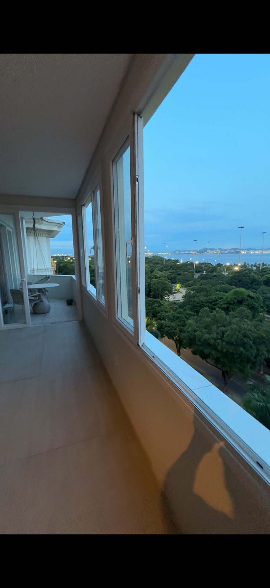 Dusk along the balcony, the park and bay below.