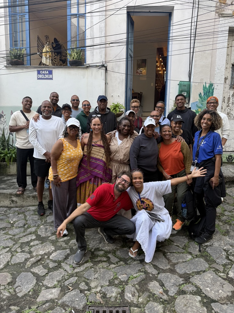 The group gathered together outside Casa Omolokum at the end of the journey
