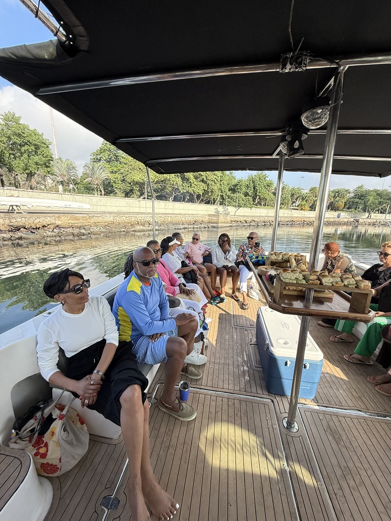 Travelers gathered on the shaded aft deck