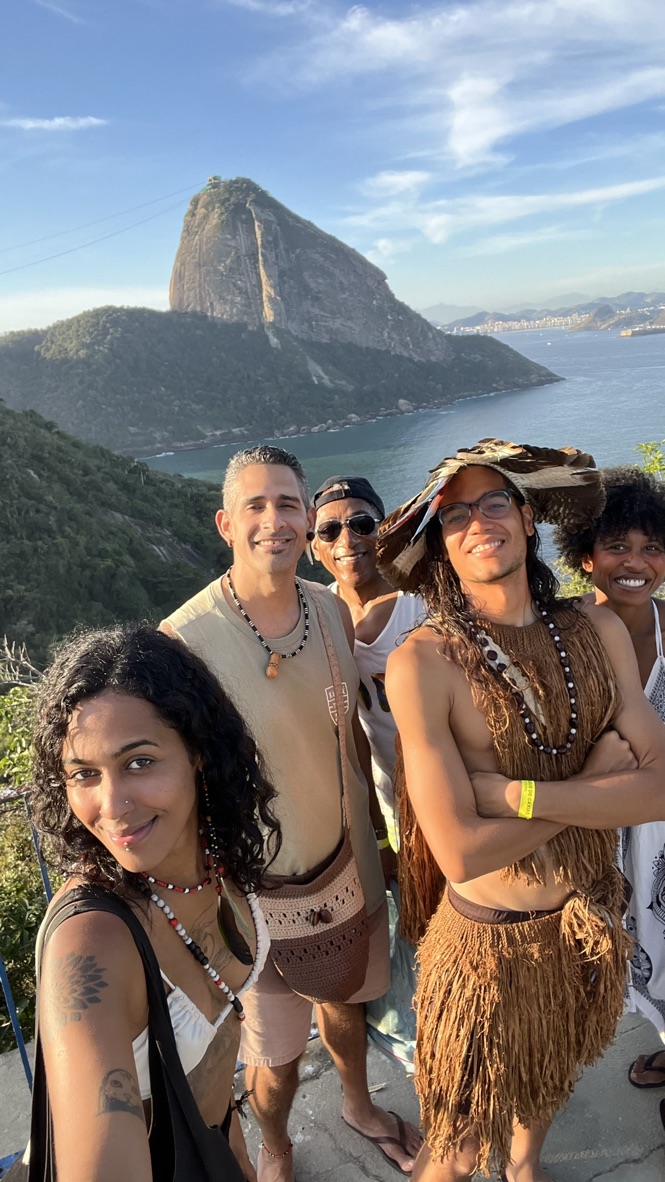 Travelers gathered at the overlook with Sugar Loaf behind them