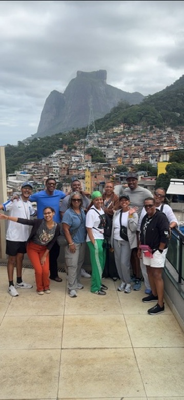 Travelers gathered at a viewpoint overlooking the community